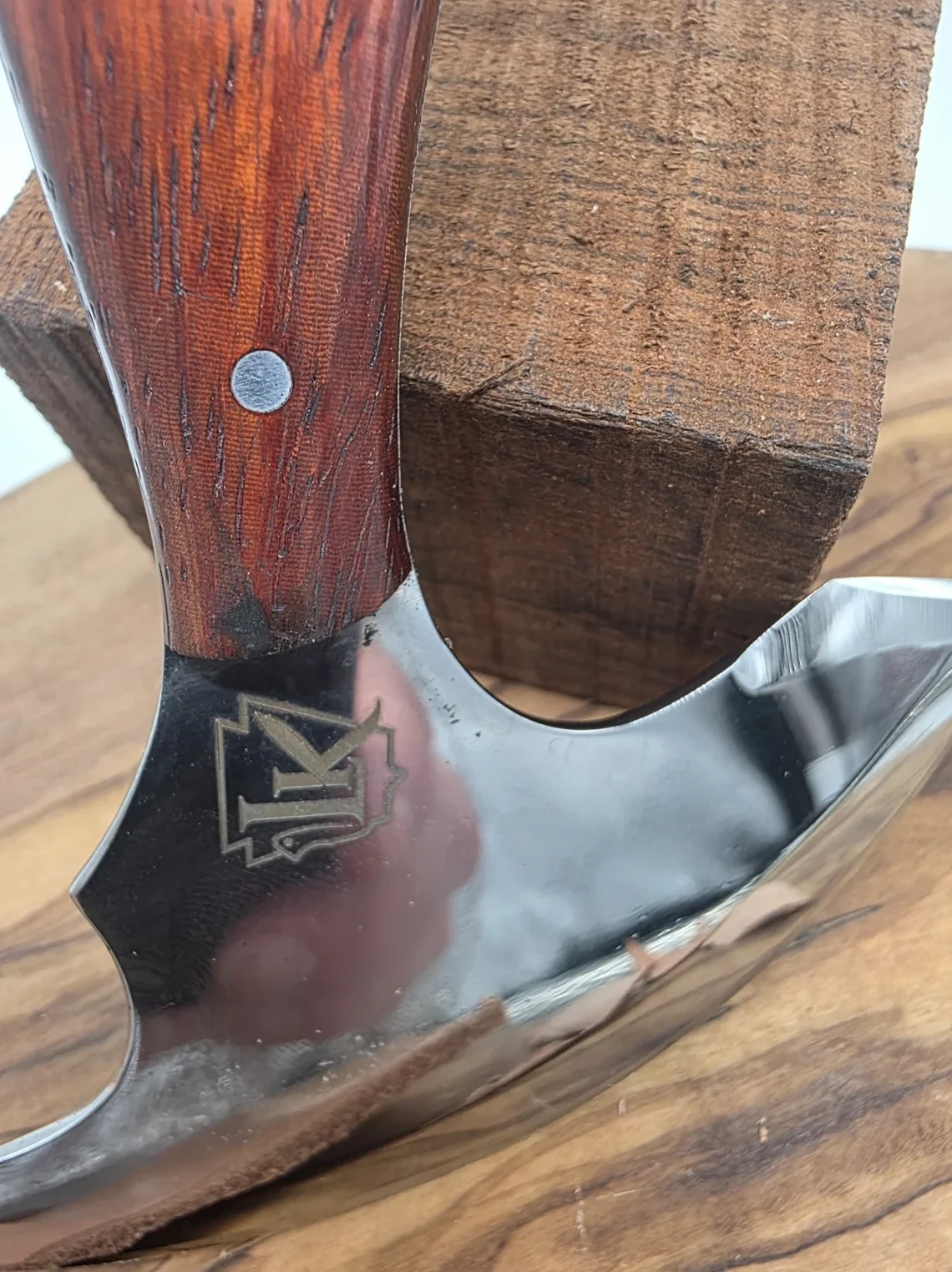 LK logo detail on Professional Leather Head Knife blade